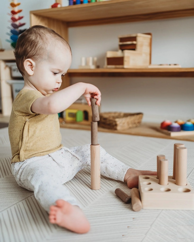 montessori wooden pole puzzle with baby