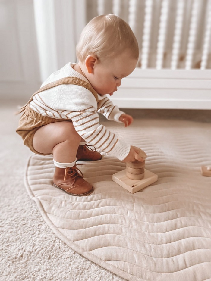 Montessori Vertical ring stacker - child playing Montessori Vertical ring stacker - child playing