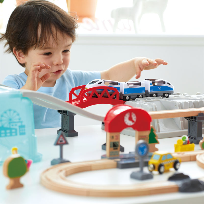 Kid Playing with Hape Train Bucket Set