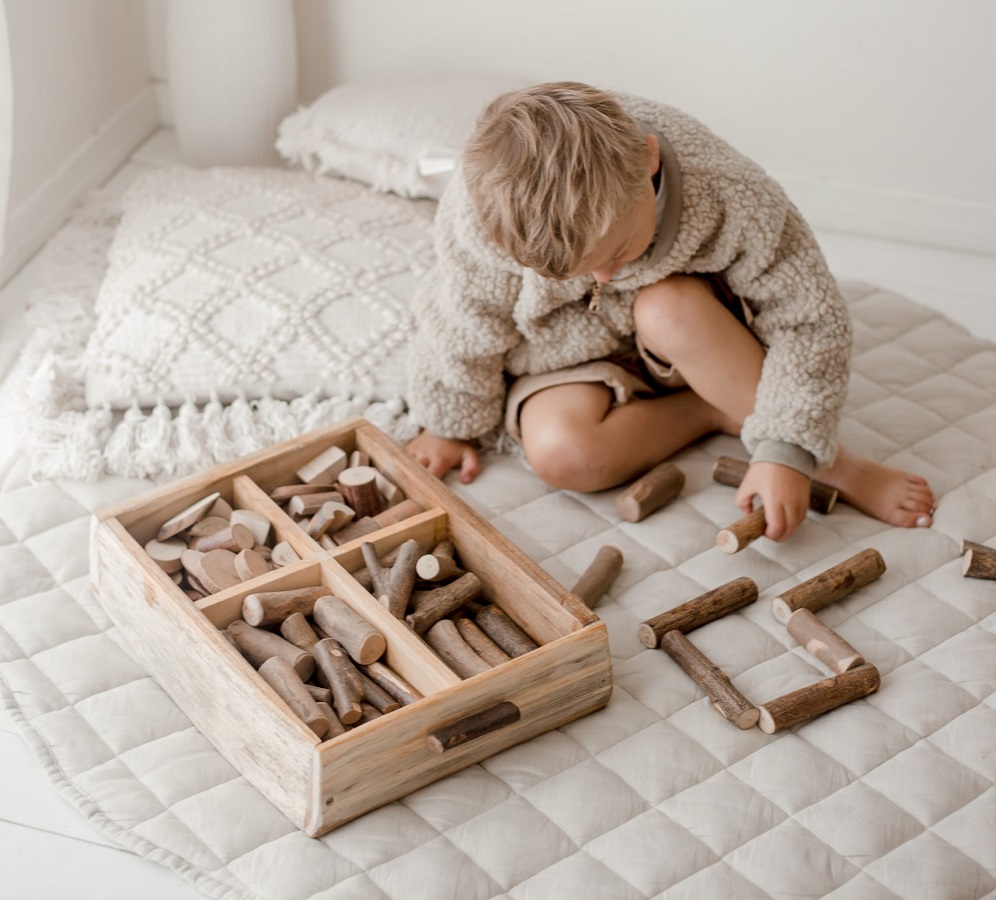 boy playing with tree blocks boy playing with tree blocks