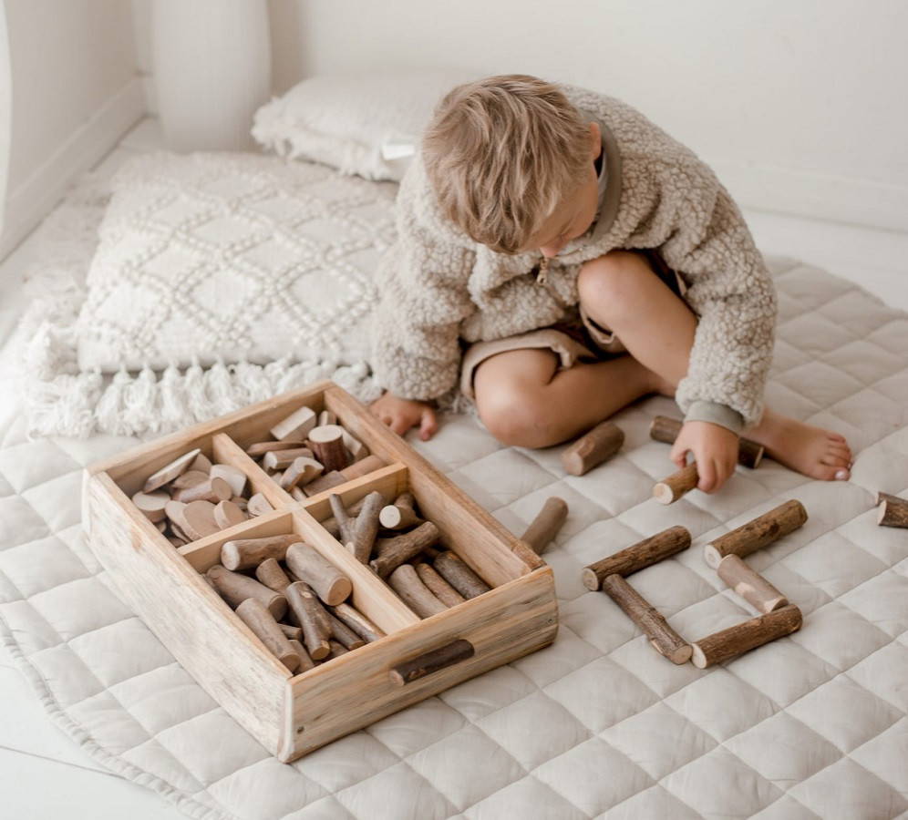 boy playing with tree blocks