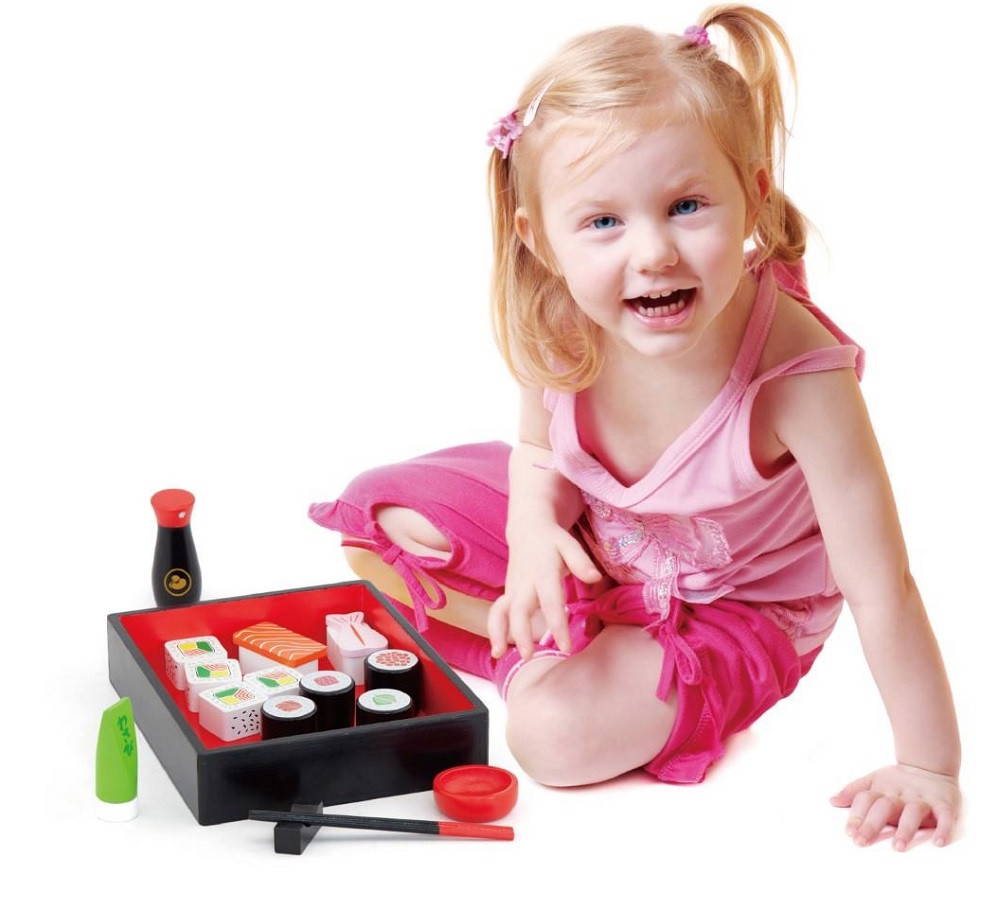 Child playing with Viga Sushi Set.