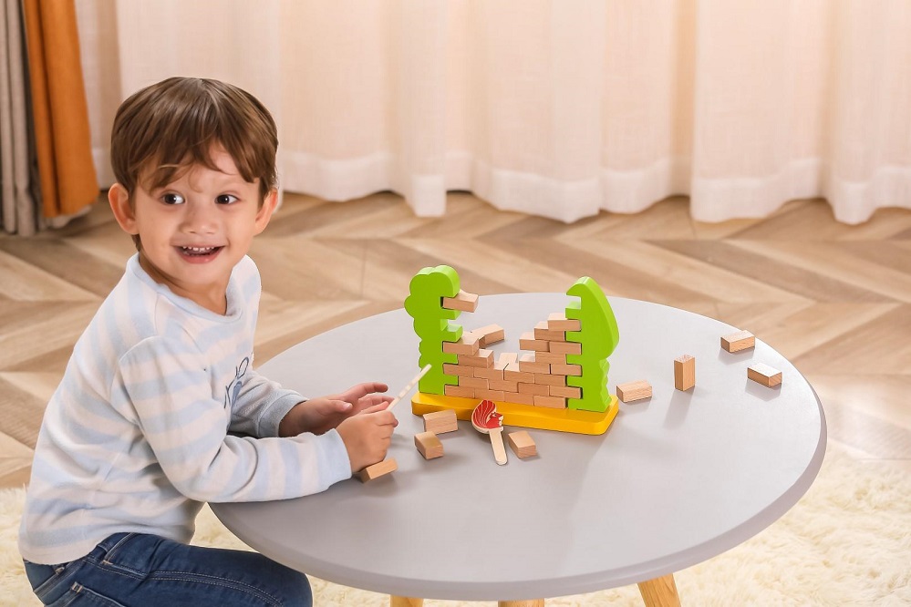 Child Playing with Viga Steady Squirrel Wall Game