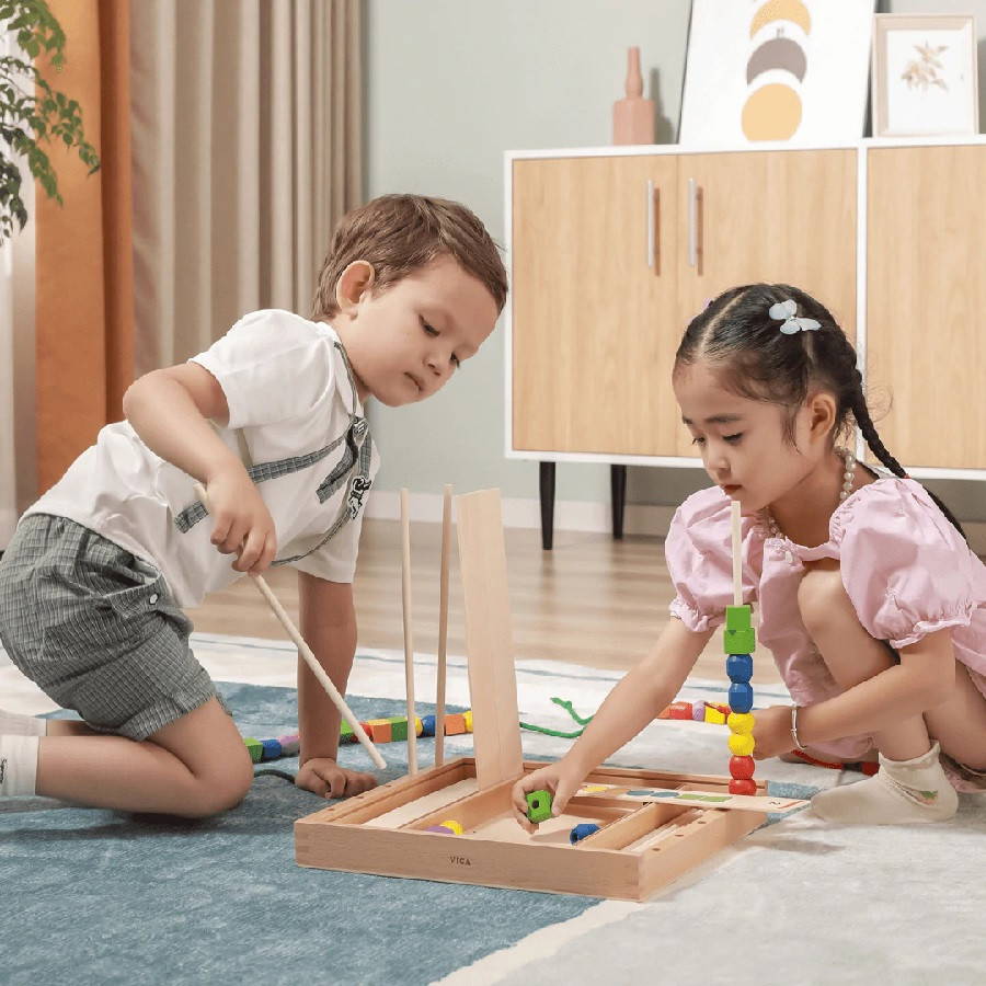 kids playing with sequence set - viga toys