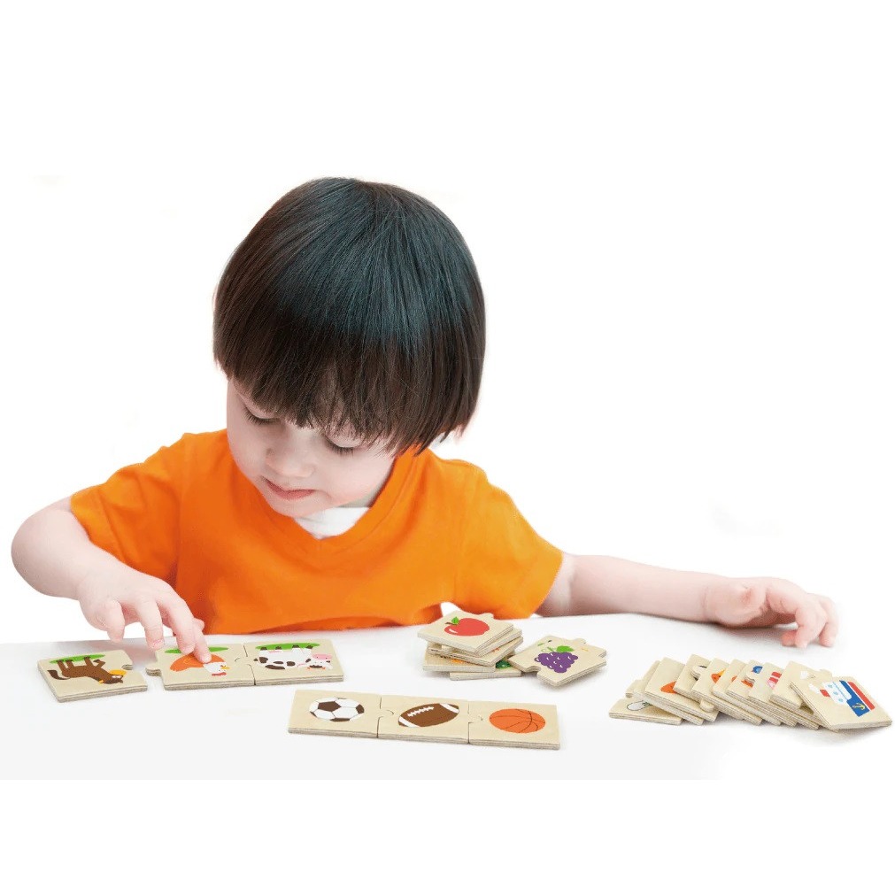 boy playing with viga category puzzle set