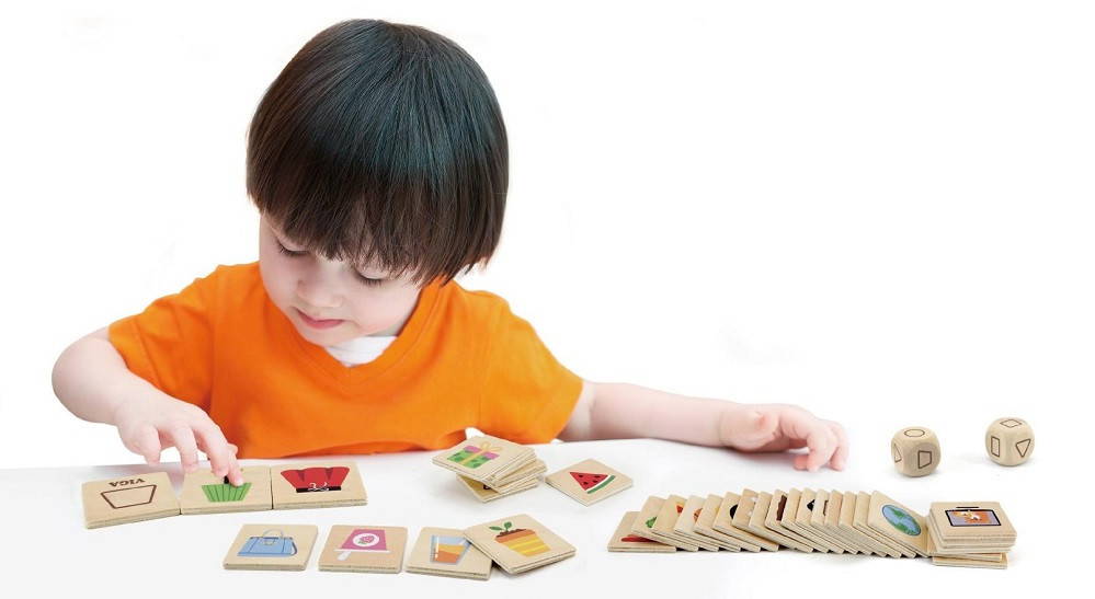 Child Playing with Learning Shapes Puzzle Set