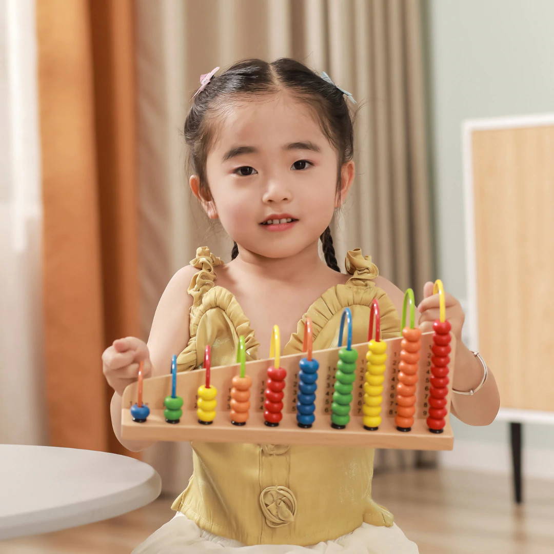 Child Playing with Viga Maths Bead Frame