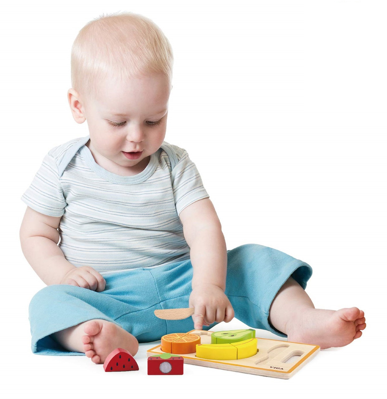 Child Playing with Viga My Cutting Fruit
