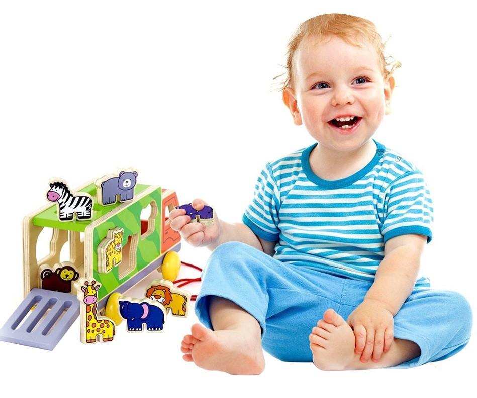 Child playing with Viga Pull-Along Animal Truck