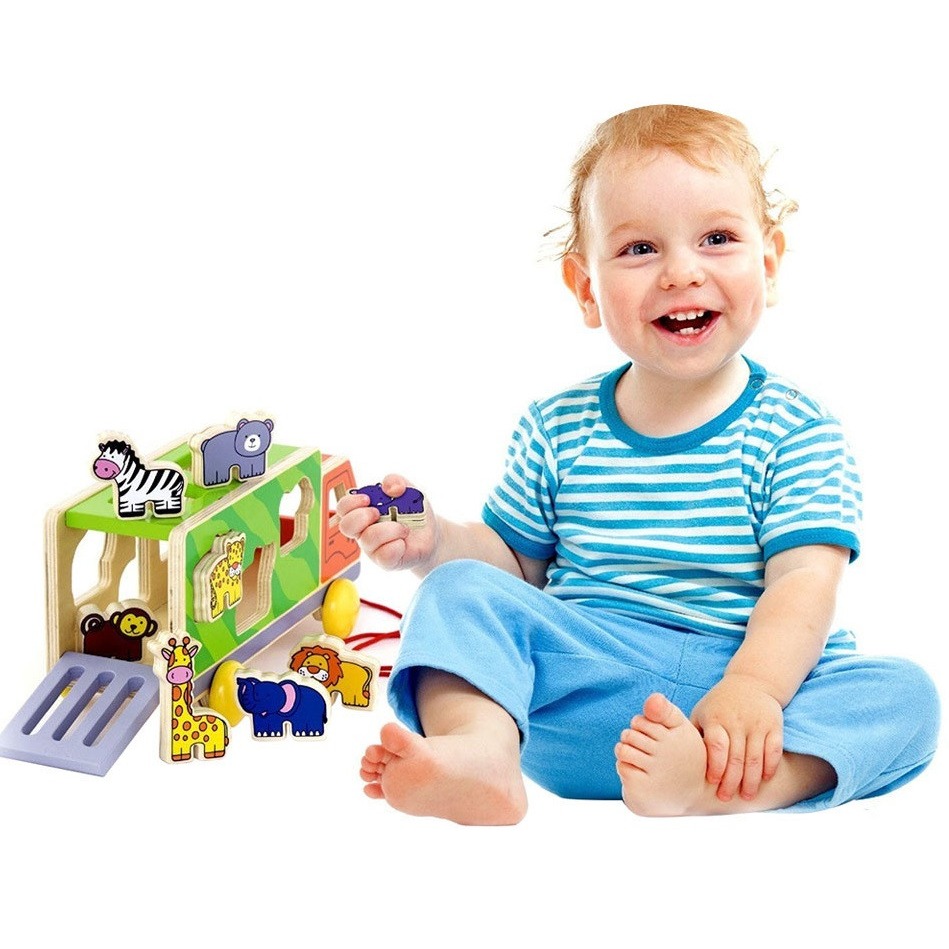 Child playing with Viga Pull-Along Animal Truck