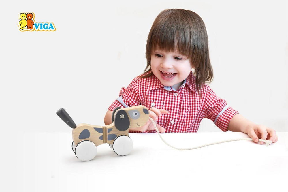 Child playing with Viga Pull Along Puppy