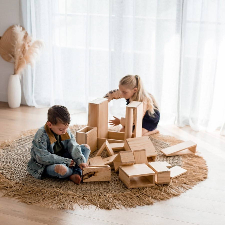 Children in collaborative play with Qtoys Unit Blocks