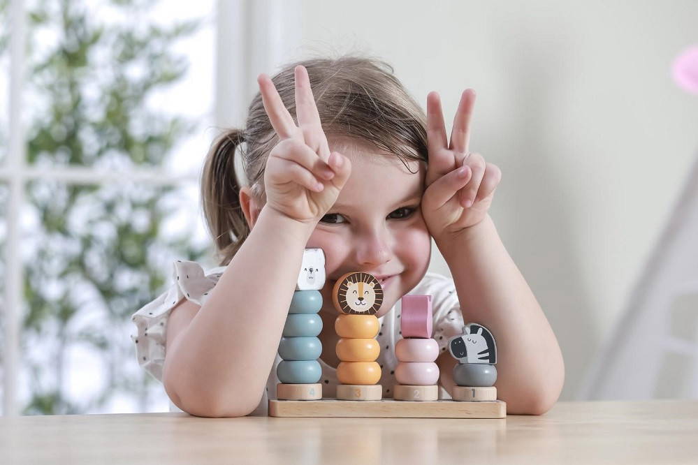 Child playing with Viga Stacking Blocks