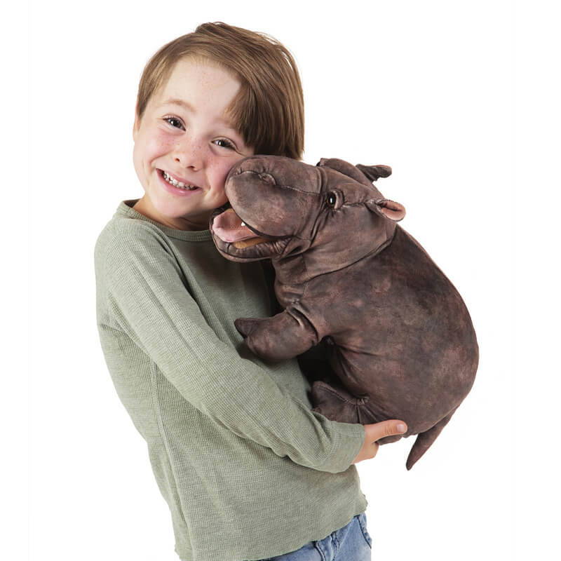 Folkmanis Baby Hippo Puppet cuddled by child