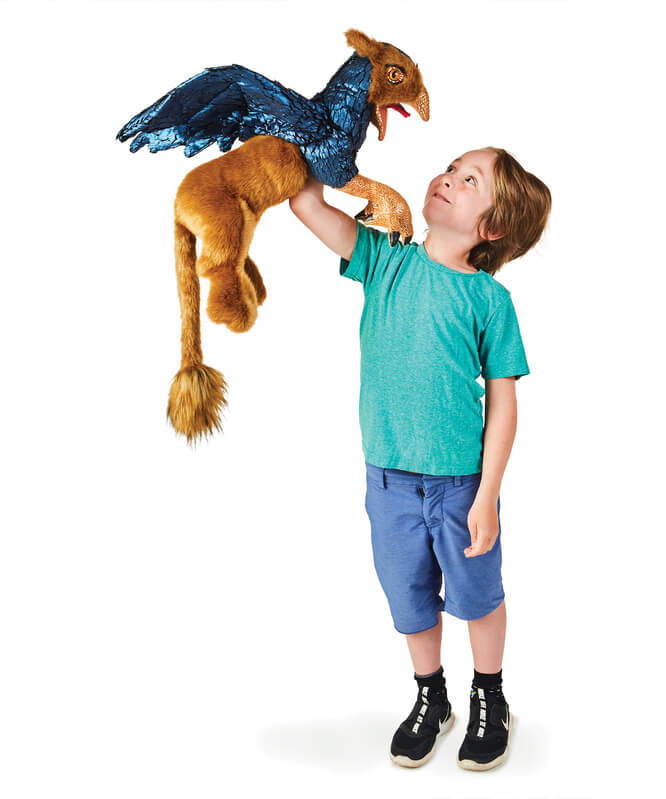 Child animating the Folkmanis Griffin Puppet