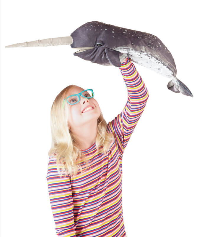 Child animating the Folkmanis Narwhal Puppet