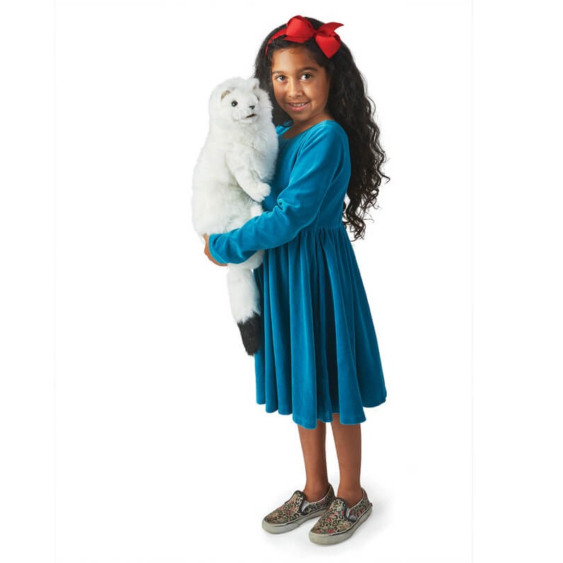 Child cuddling with Folkmanis Ermine Puppet