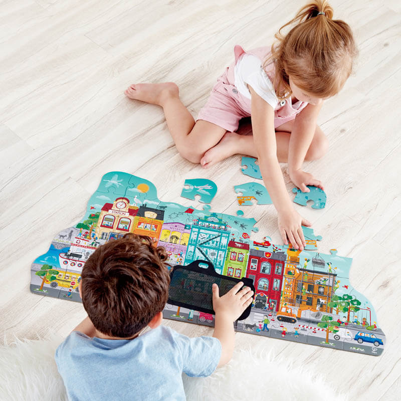 Children playing with Hape Animated City Puzzle Children playing with Hape Animated City Puzzle