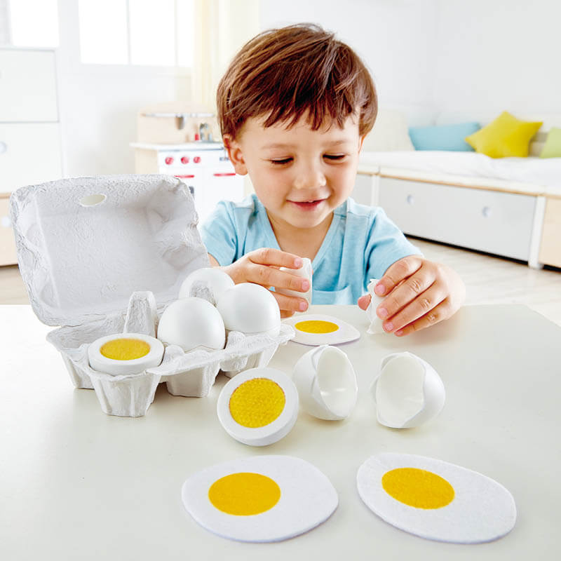 Child playing with Hape Egg Carton