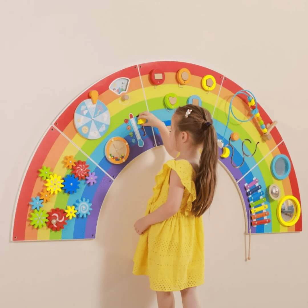 Child playing with Viga Wall Activity Panel
