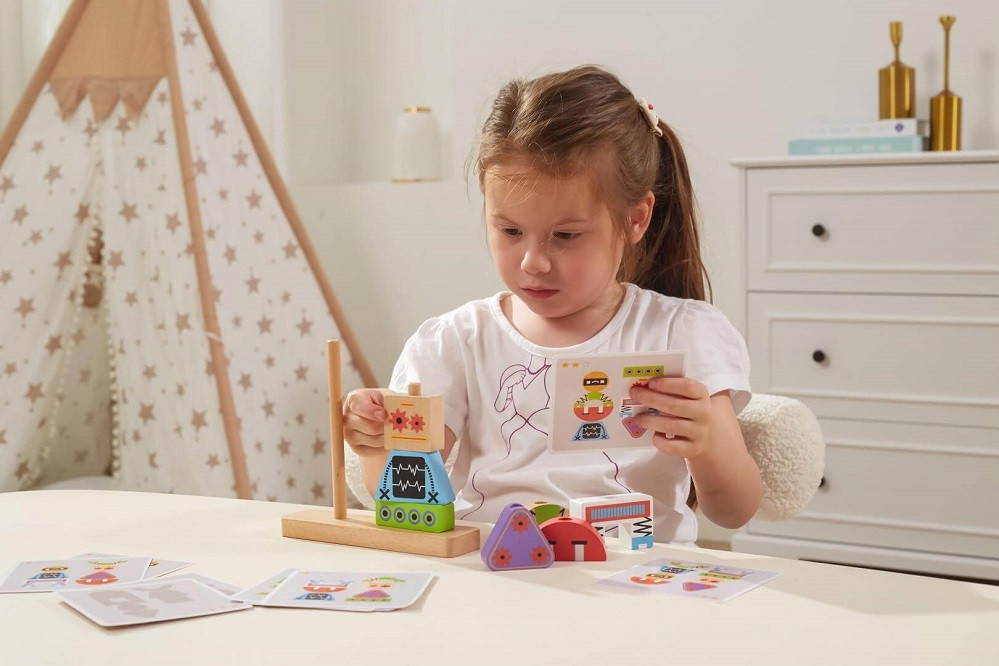 Child playing with Viga Robot Stacking Blocks