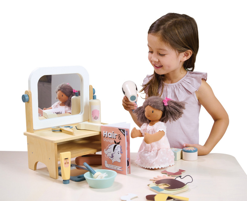 Child playing with doll using Tenderleaf Hair Salon Set