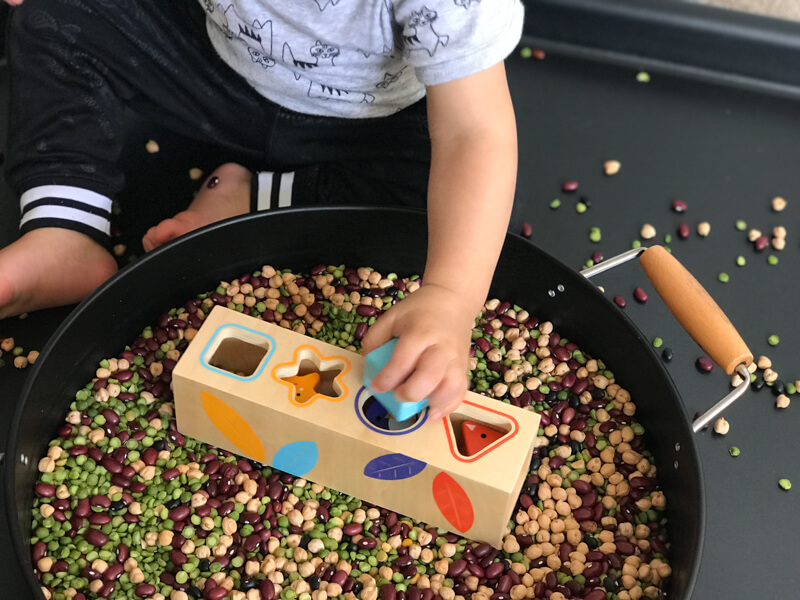 Djeco Boitabasic Shape Sorter in a sensory tray Djeco Boitabasic Shape Sorter in a sensory tray