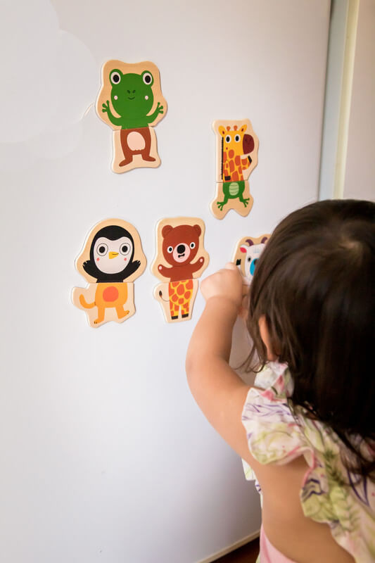 Kid playing with Djeco Wooden Magnetic Jungle Set