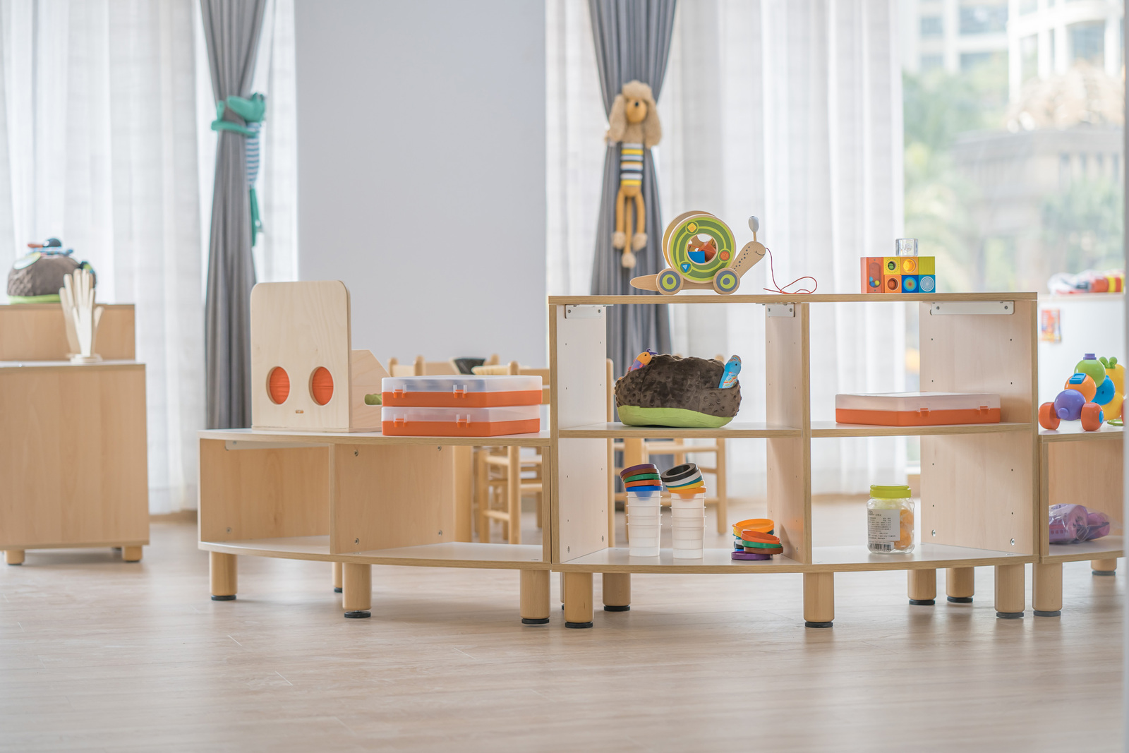 curved shelf combined with others in childcare room curved shelf combined with others in childcare room