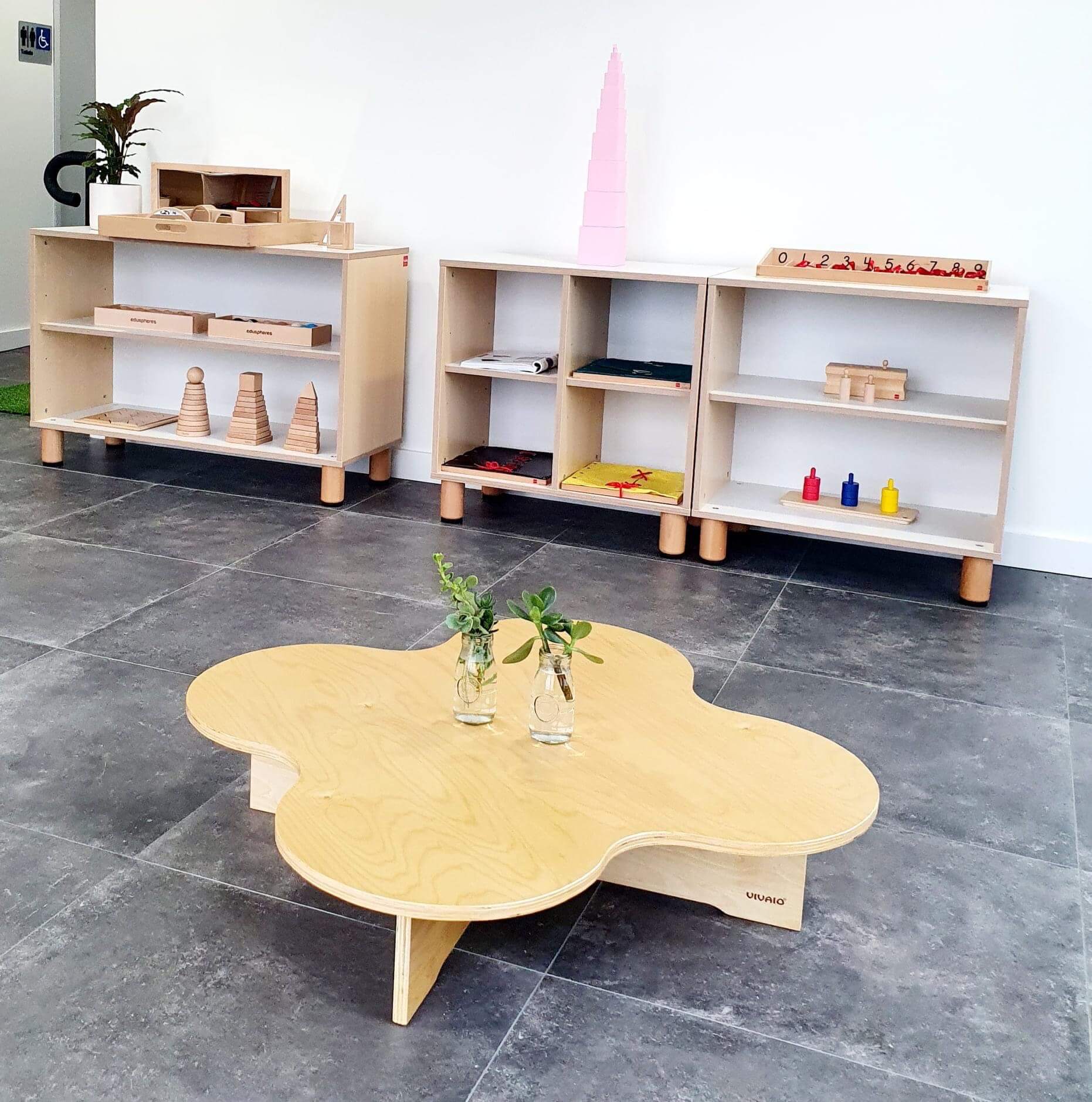 low kids wooden table in classroom
