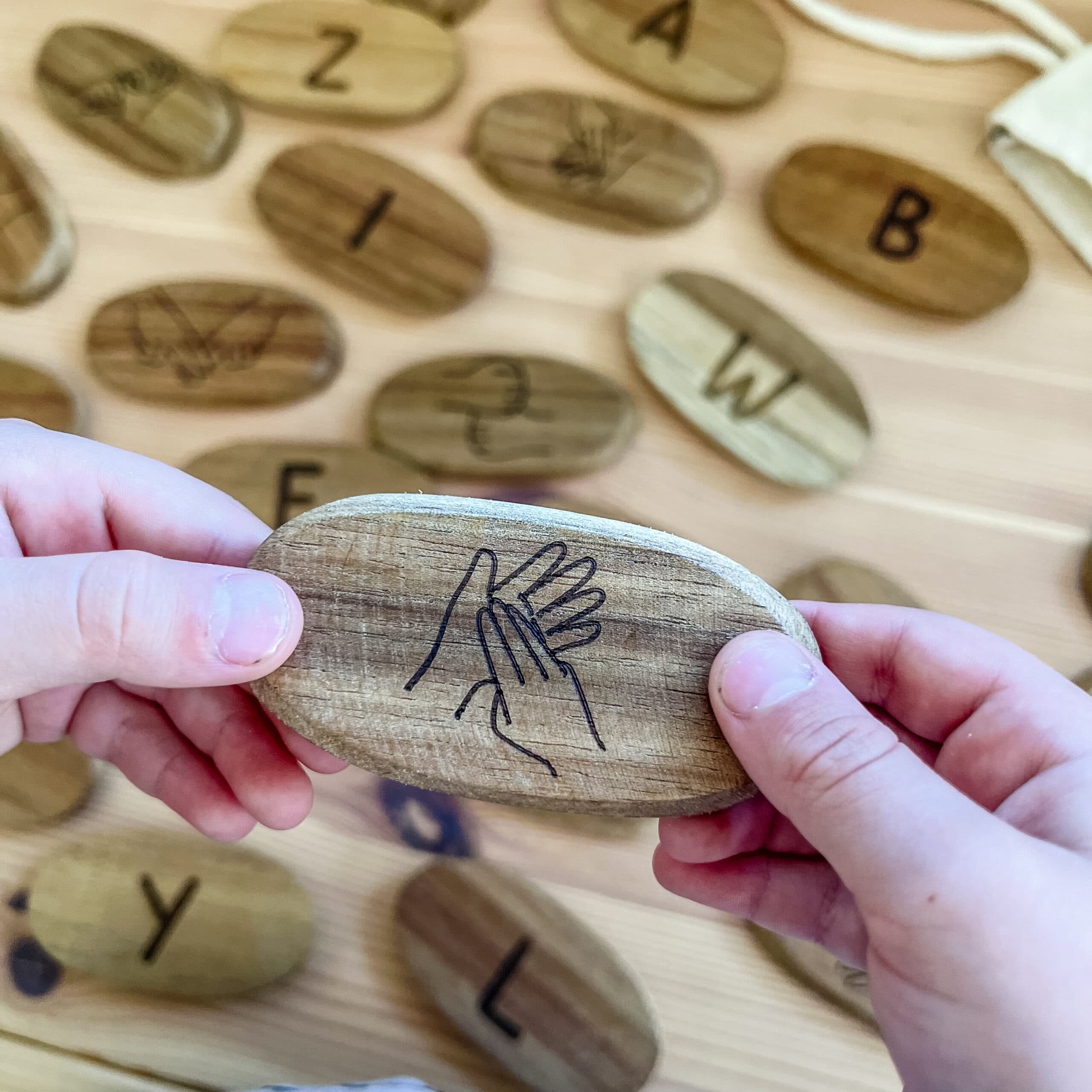 Wooden Sign Language Stones close up