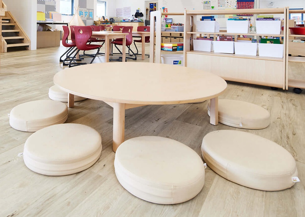 harmony low round wooden table in early learning room