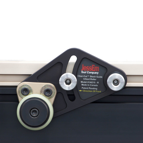 Clear-Cut Stock Guides mounted to a router-table fence, close-up showing rollers at a 5-degree angle