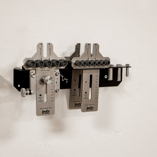 JessEm Stainless Steel Dowelling Jig Weekend Hobbyist Package 08359 mounted on wall bracket, off-white wall view.