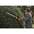 DeWalt DCHT820B cutting tall hedge outdoors