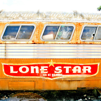 Dubbed the "National Beer of Texas", Lone Star Beer is written across this abandoned air stream in Austin, Texas.