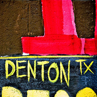 Showing off Denton, Texas pride, this mural was done in true Denton colors with graffiti letters.