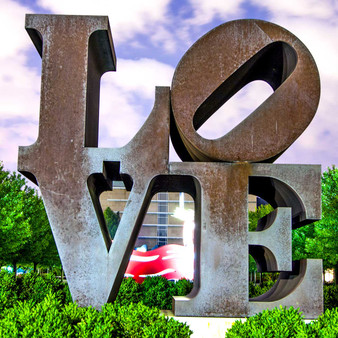 <p>Love's original rendering in sculpture was made in 1970 and is displayed in Indiana at the Indianapolis Museum of Art. The material is COR-TEN steel. Indiana's Love design has since been reproduced in a variety of formats for rendering in displays around the world.<p><p>Click &lsquo;Choose a Product&rsquo; above to get this image handprinted on a ceramic 4x4 custom coaster, cutting board, magnet, ceramic trivet, ornament, dog tag or canvas.<p>