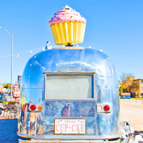 Cupcakes are the draw at this whimsical shop operating out of a parked trailer with outdoor seating.