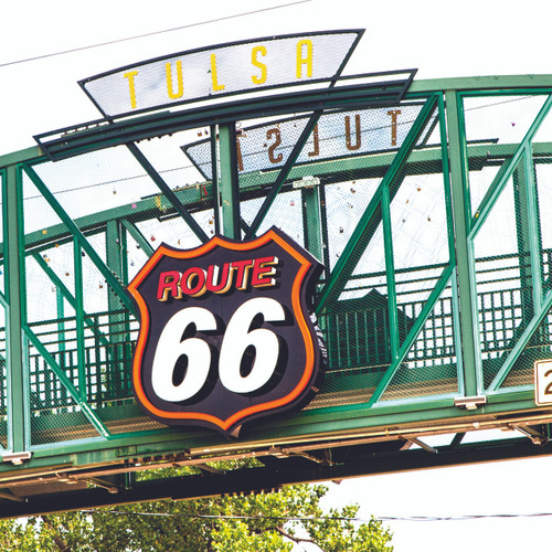 A Route 66 sign on the pedestrian bridge on 11st Street at Cyrus Avery Plaza in Tulsa Oklahoma. A tribute and memorial to this historic piece of Americana. A Route 66 sign on the pedestrian bridge on 11st Street at Cyrus Avery Plaza in Tulsa Oklahoma. A tribute and memorial to this historic piece of Americana.