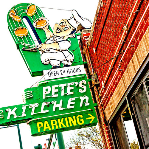This lively vintage neon sign marks the location of Pete's Kitchen in Denver, Colorado. Pete's menu ranges from breakfast burritos to gyros in a classic, family-owned-&-operated diner open 24/7. This lively vintage neon sign marks the location of Pete's Kitchen in Denver, Colorado. Pete's menu ranges from breakfast burritos to gyros in a classic, family-owned-&-operated diner open 24/7.