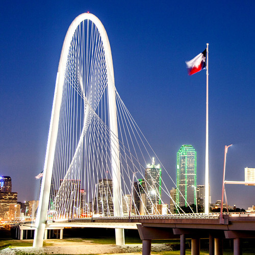 Spanning the Trinity River, the Margaret Hunt Hill Bridge  named after the philanthropist, Margaret Hunt  this bridge was built to be seen and awed at. Showcasing a glimpse of its dramatic detail, is a picture of the Hunt Hill bridge at night.