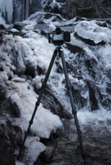 Ascend in front of a waterfall with a camera on it