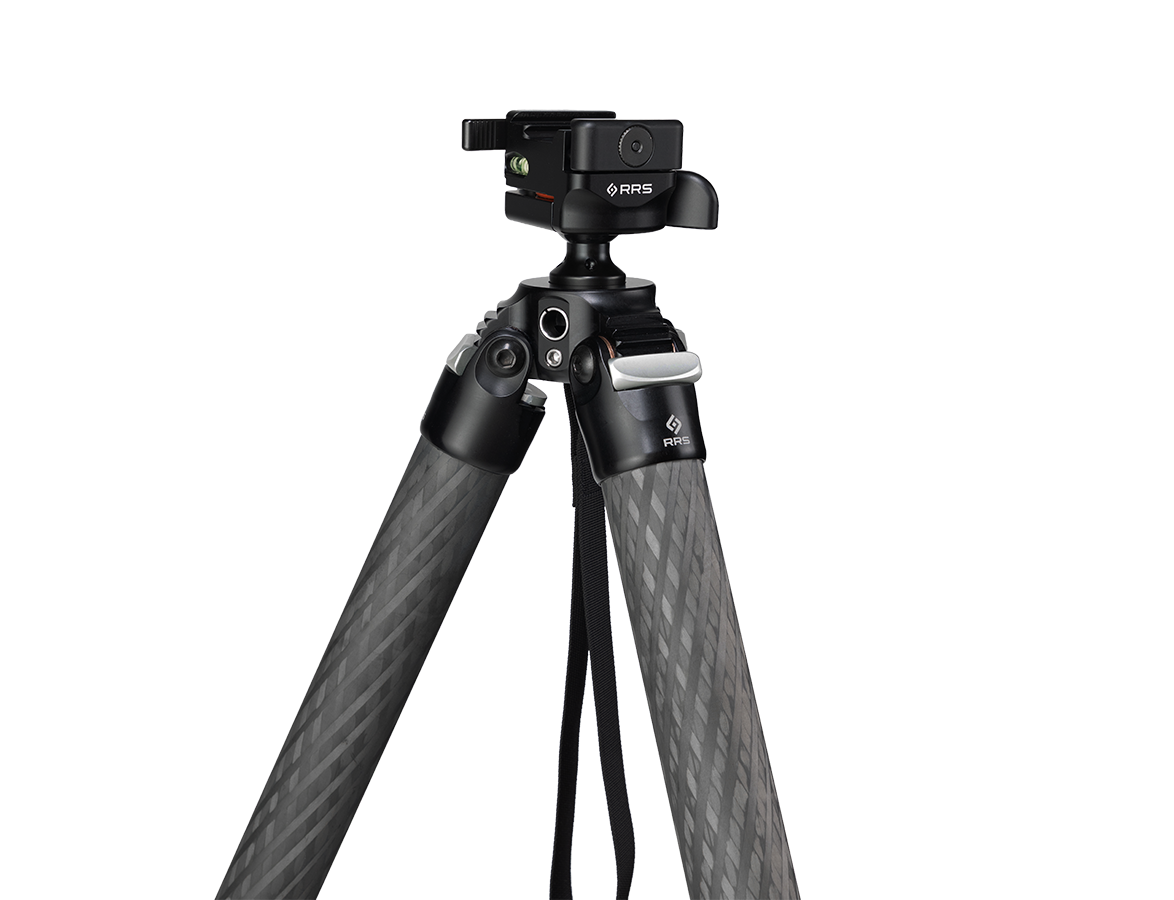 Shooter behind rifle in seated or standing position on the Benchmark tripod with wide leg stance; inset of apex and Anvil-30 showing compact, centered mass