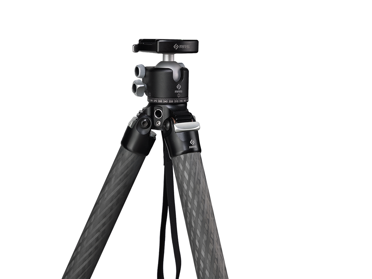 Night or blue hour cityscape or landscape with the Benchmark tripod on uneven ground; detail of the apex and BH-40 head showing clean, minimal flex points