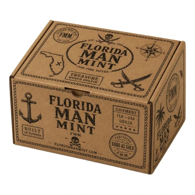 Ships in the Florida Man Mint box — Treasure-cased coin, numbered 4x6 Certificate, story postcard, and velvet pouch