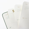 Fanned pages of the 2027 Making Memory Mini weekly planner showing April and May headings and lined planning sections.