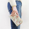 Willow story illustration pattern half zip around clutch