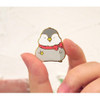 N.IVY Pochapeng red muffler metal pin badge