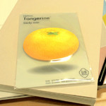 Tangerine sticky memo notes
